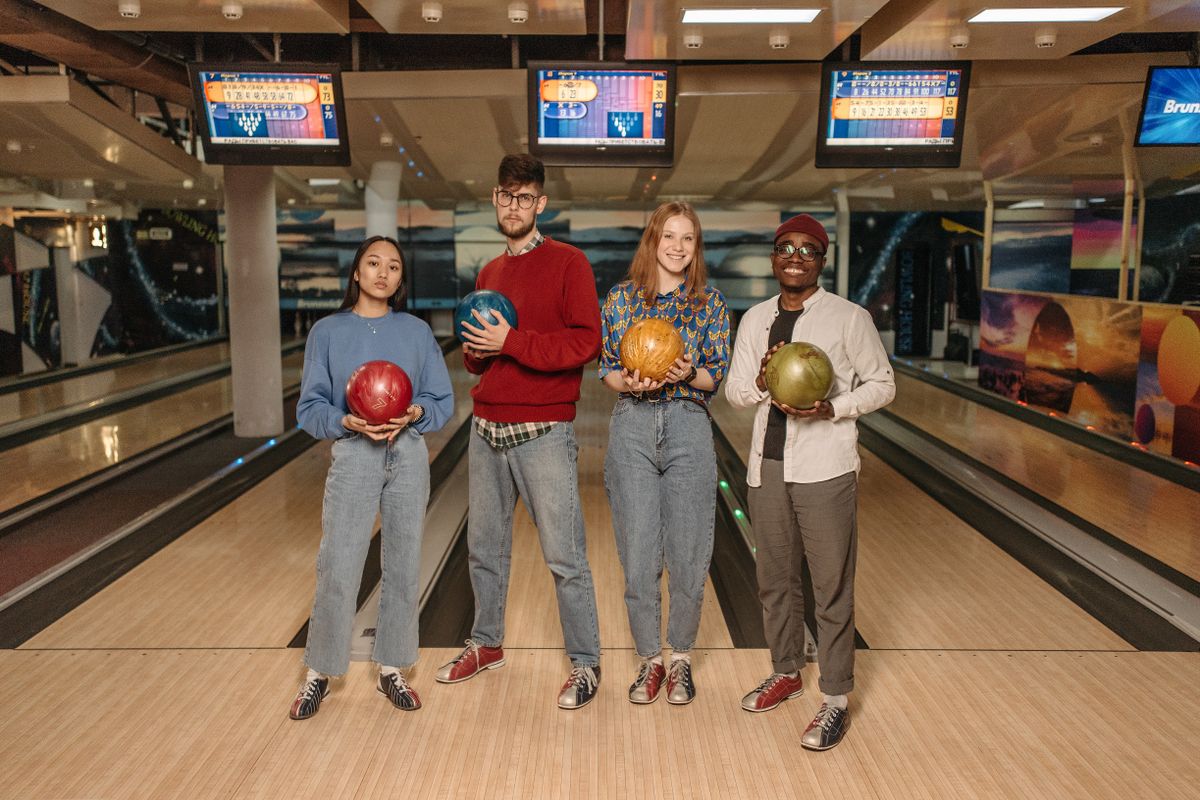 A group enjoying a bowling activity together, representing group programs