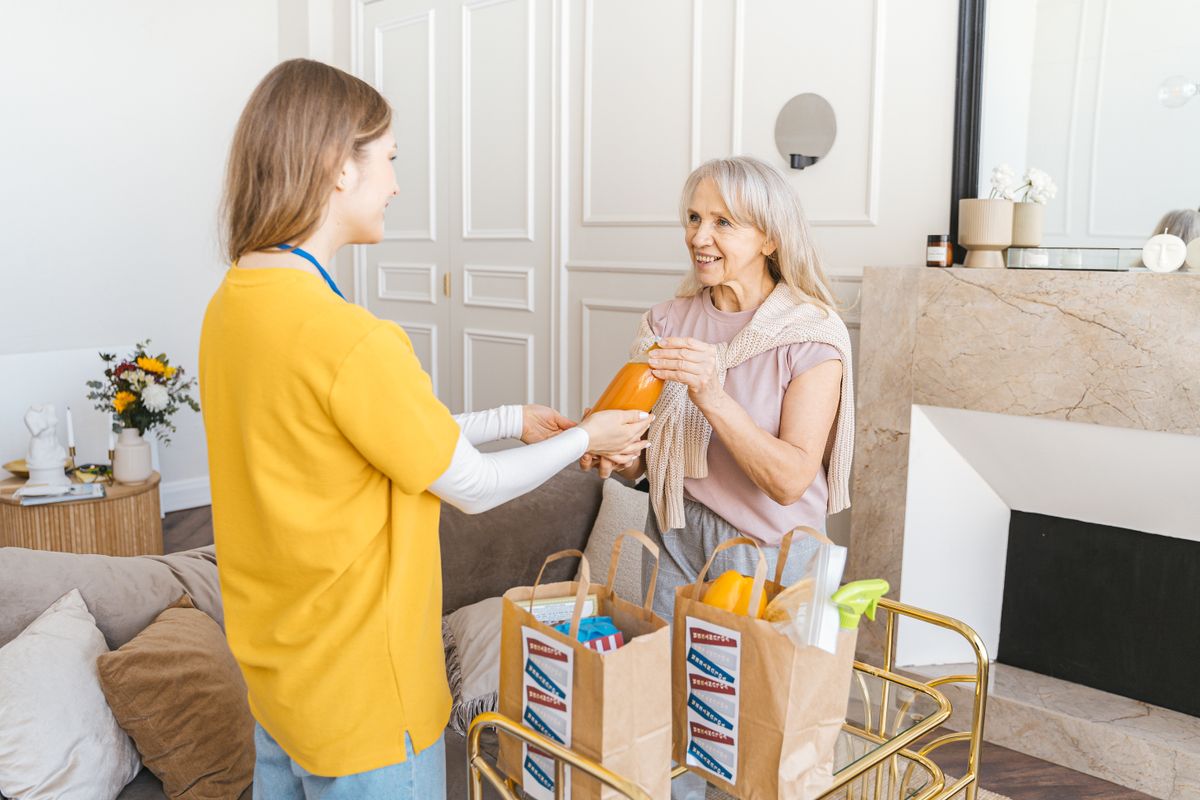 Helping with groceries around the home, representing domestic assistance